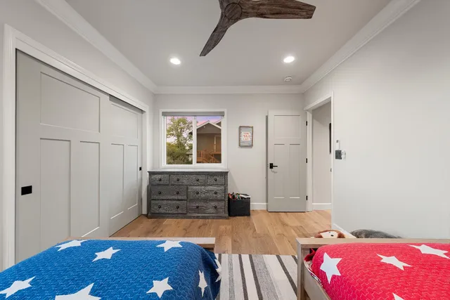 a kitchen with refrigerator cabinets dining table and chairs