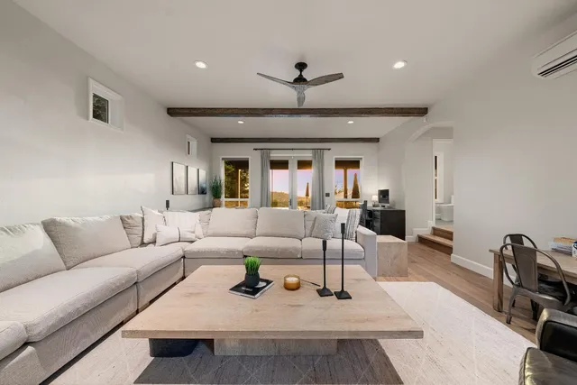 a front view of a house with a garden and yard