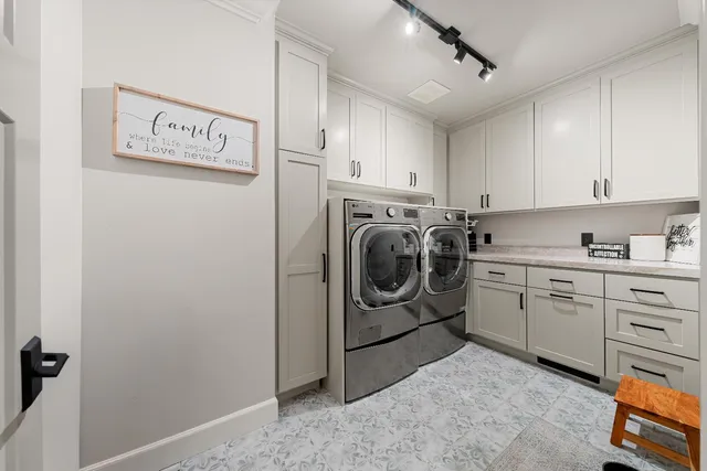 a front view of a house with a garden and yard