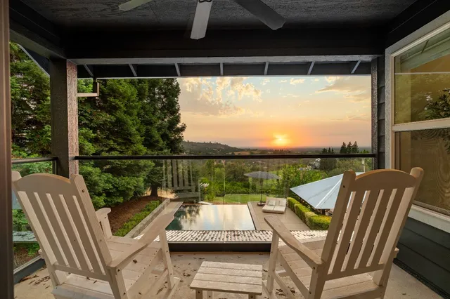 a view of a chairs and table in the patio