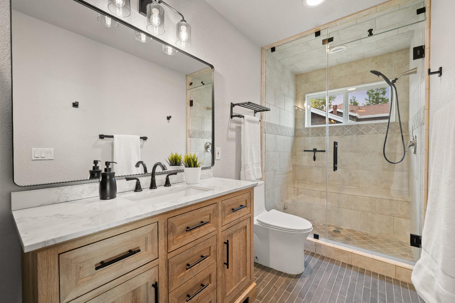 7380 Ridge Road Newcastle, CA 95658 - Photo 64 of 89 a bathroom with a granite countertop shower sink vanity mirror and toilet