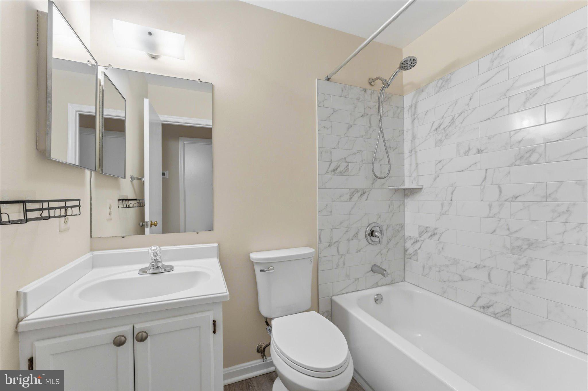 2753 Bixby Road Woodbridge, VA 22193 - Photo 14 of 22 a bathroom with a sink a toilet and shower