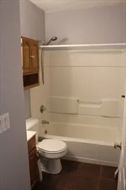 a bathroom with a toilet a sink and bathtub