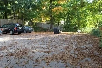 a view of street with parked cars