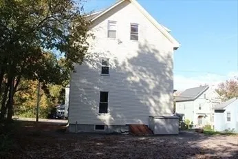 a view of a back yard of the house