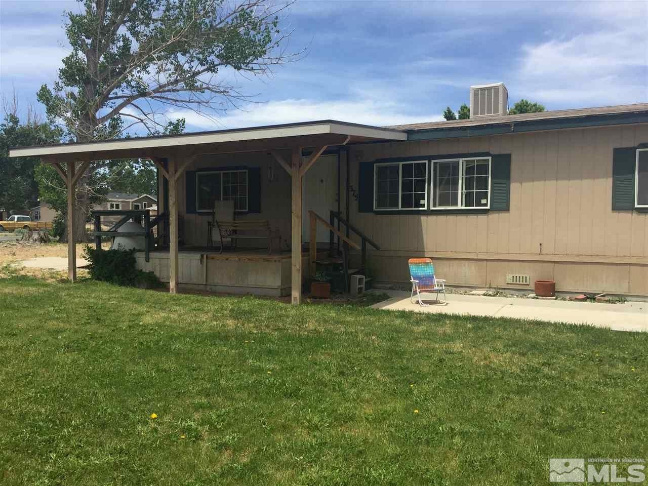 375 Magnolia Way Reno, NV 89506 - Photo 1 of 1 a backyard of a house with yard table and chairs
