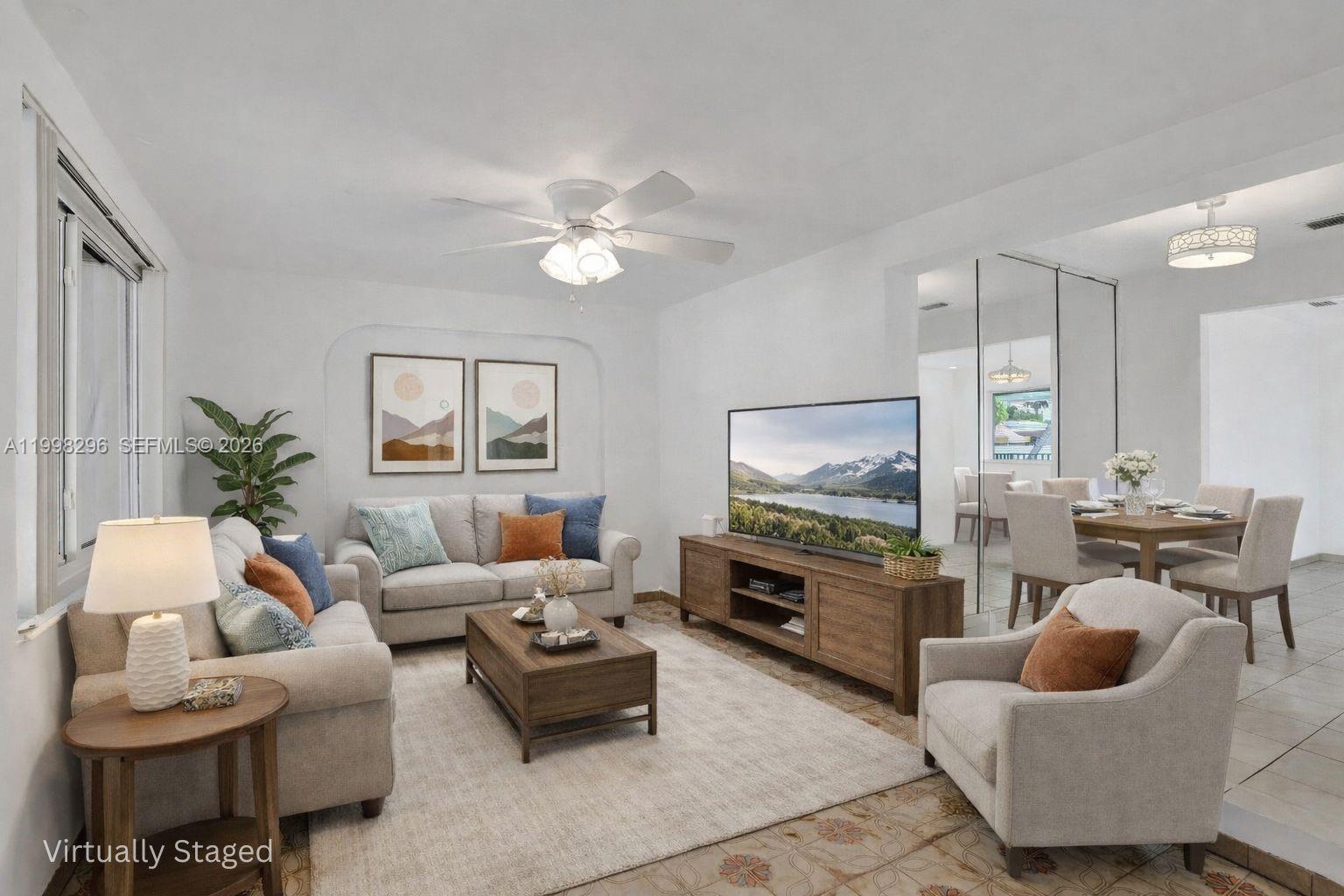 877 West 33rd Street Hialeah, FL 33012 - Photo 11 of 59 a living room with furniture and a flat screen tv