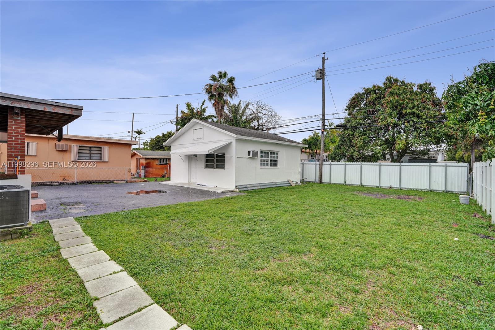 877 West 33rd Street Hialeah, FL 33012 - Photo 17 of 59 a view of a yard in front of a house