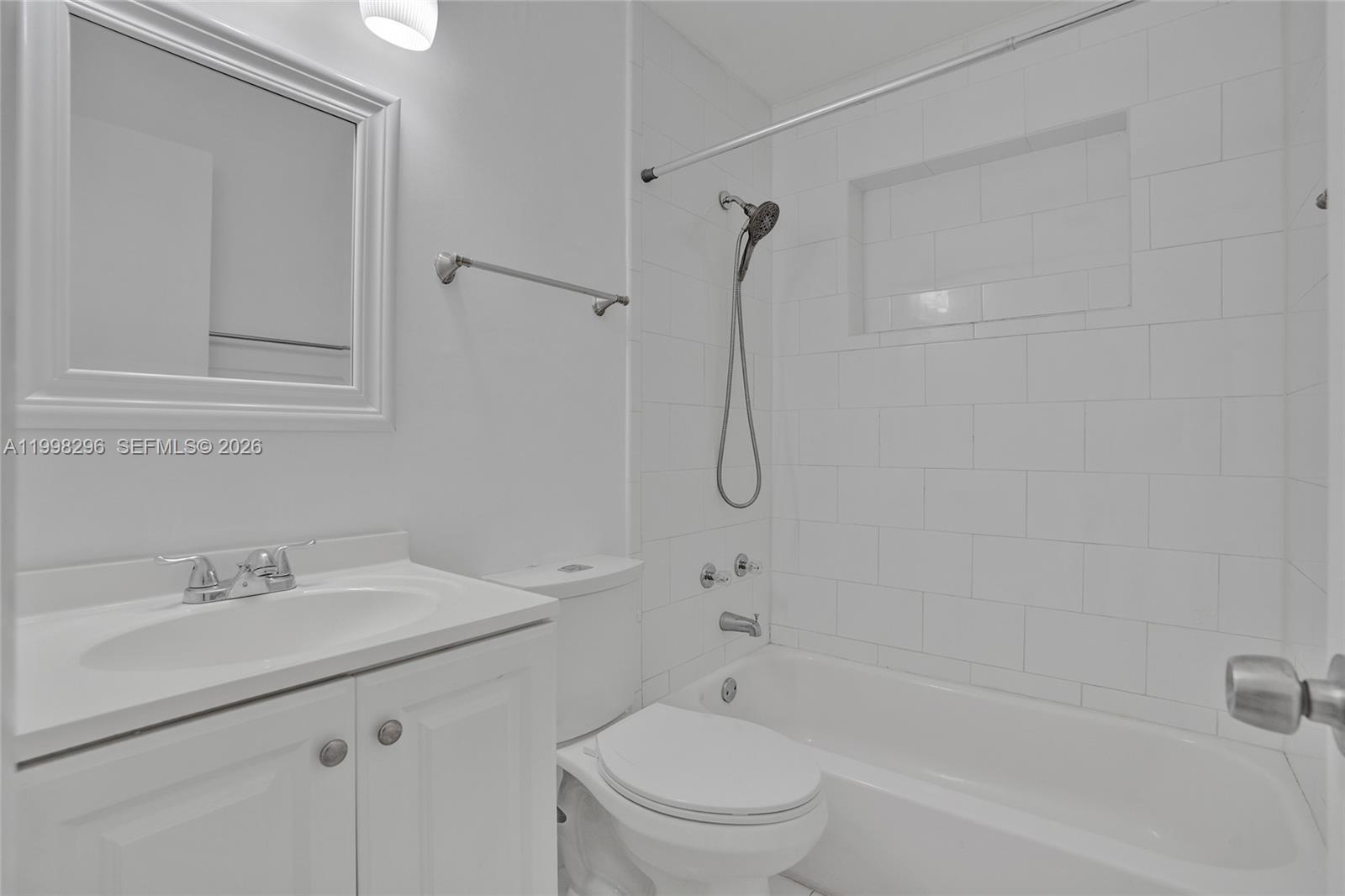 877 West 33rd Street Hialeah, FL 33012 - Photo 30 of 59 a bathroom with a sink a toilet and shower