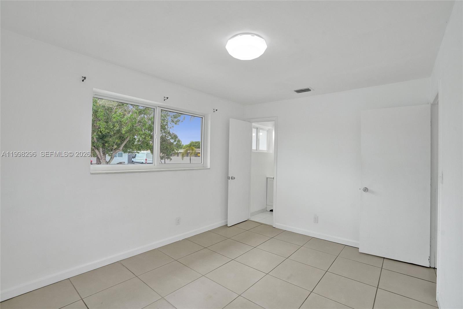 877 West 33rd Street Hialeah, FL 33012 - Photo 32 of 59 a view of room with window