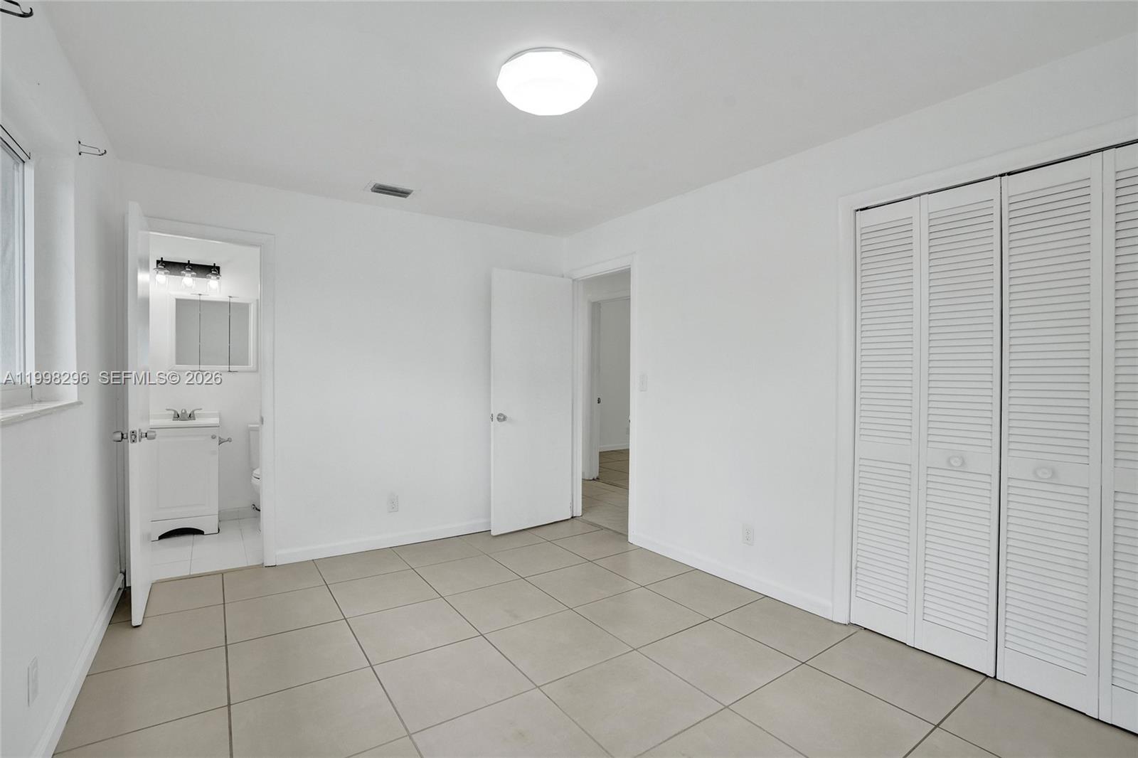 877 West 33rd Street Hialeah, FL 33012 - Photo 33 of 59 a view of an empty room with closet area