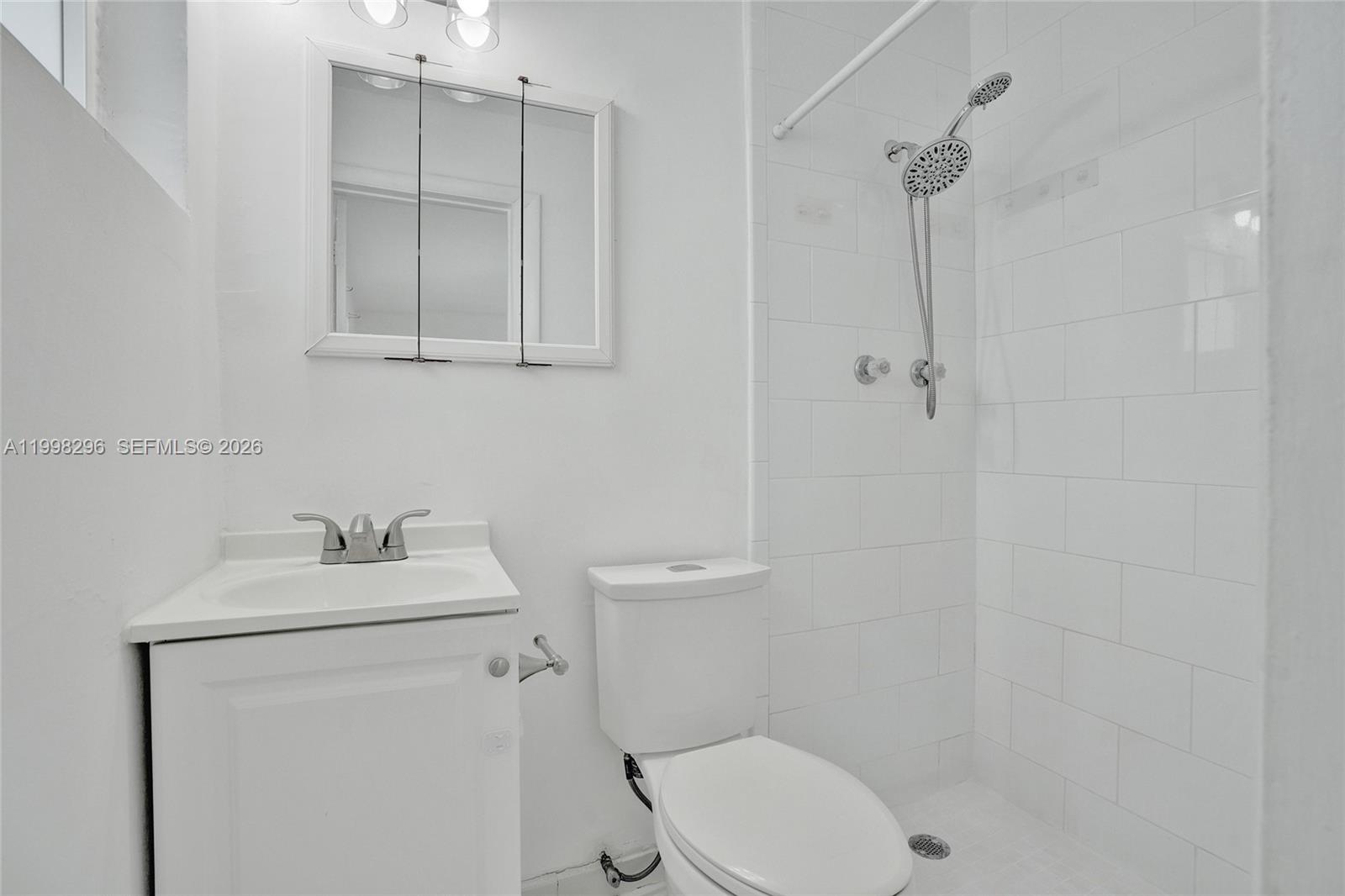877 West 33rd Street Hialeah, FL 33012 - Photo 35 of 59 a bathroom with a sink toilet and vanity