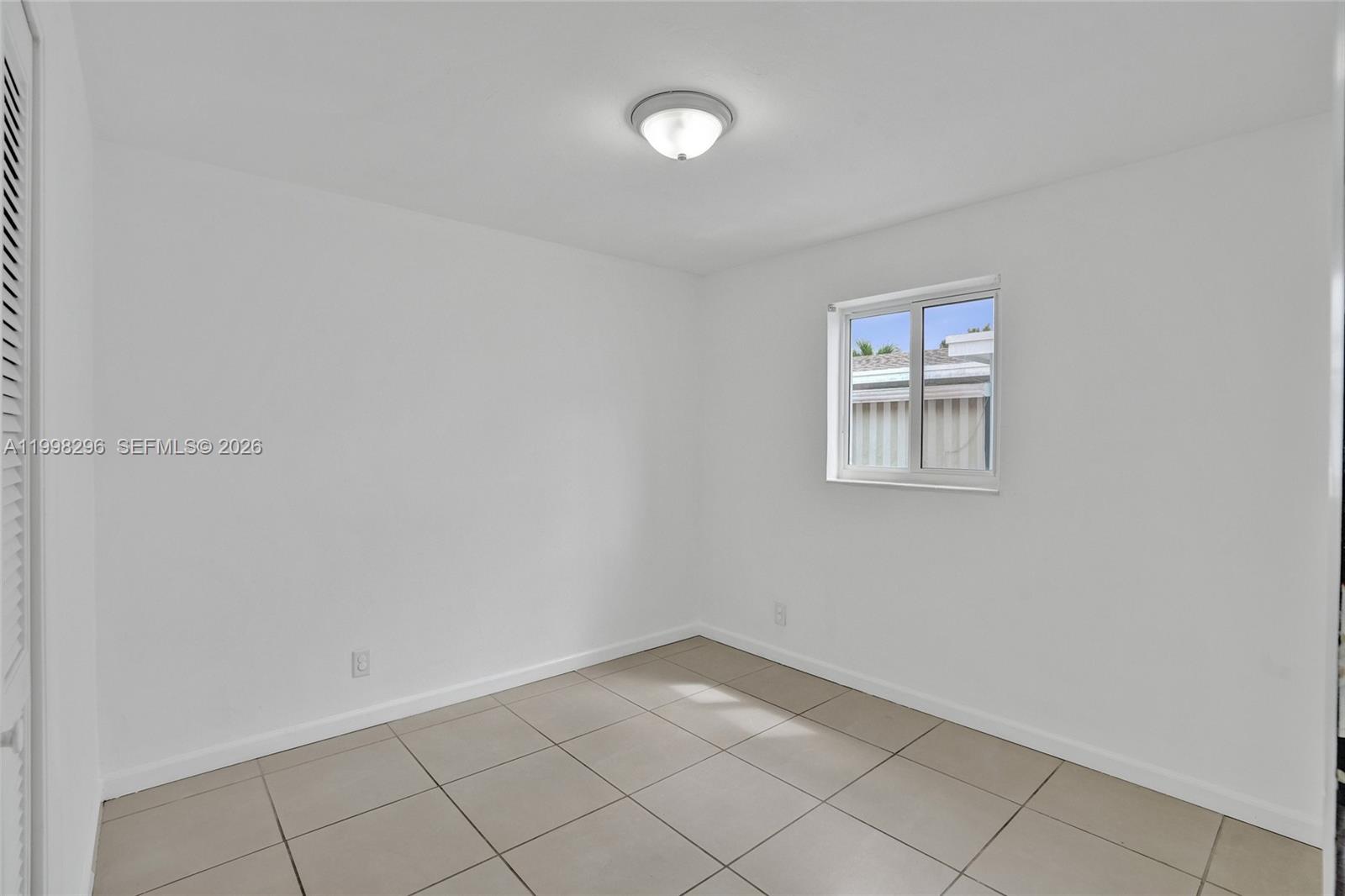 877 West 33rd Street Hialeah, FL 33012 - Photo 38 of 59 wooden floor in a empty room