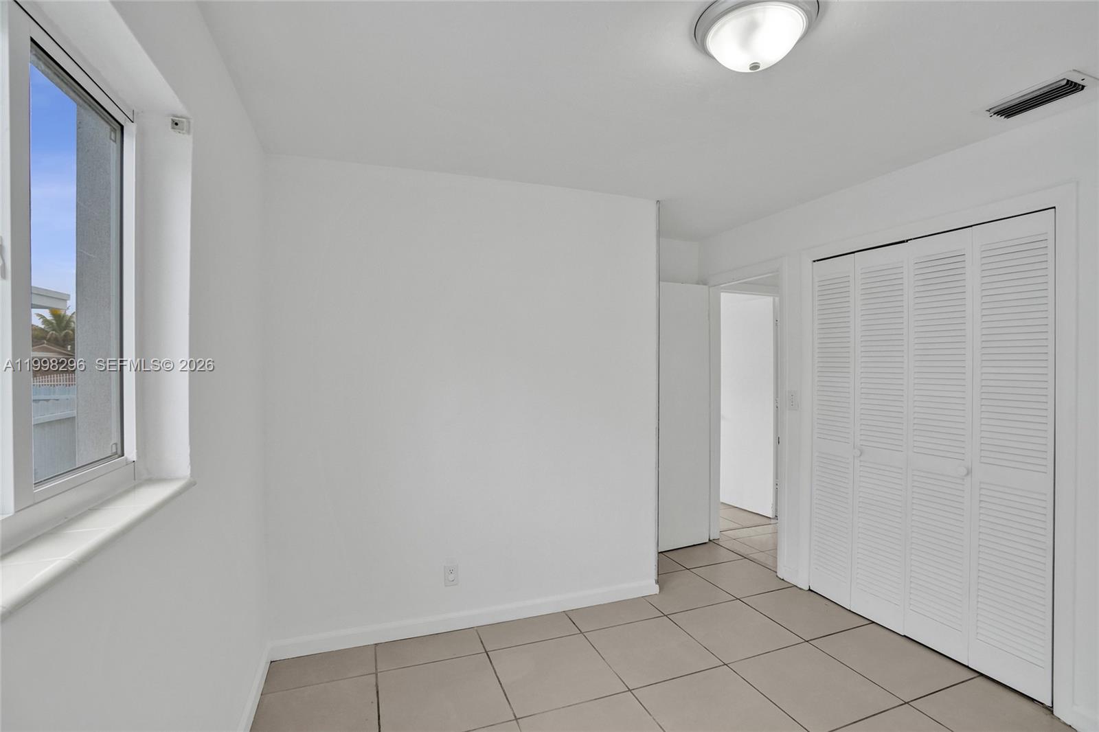 877 West 33rd Street Hialeah, FL 33012 - Photo 40 of 59 a view of an empty room