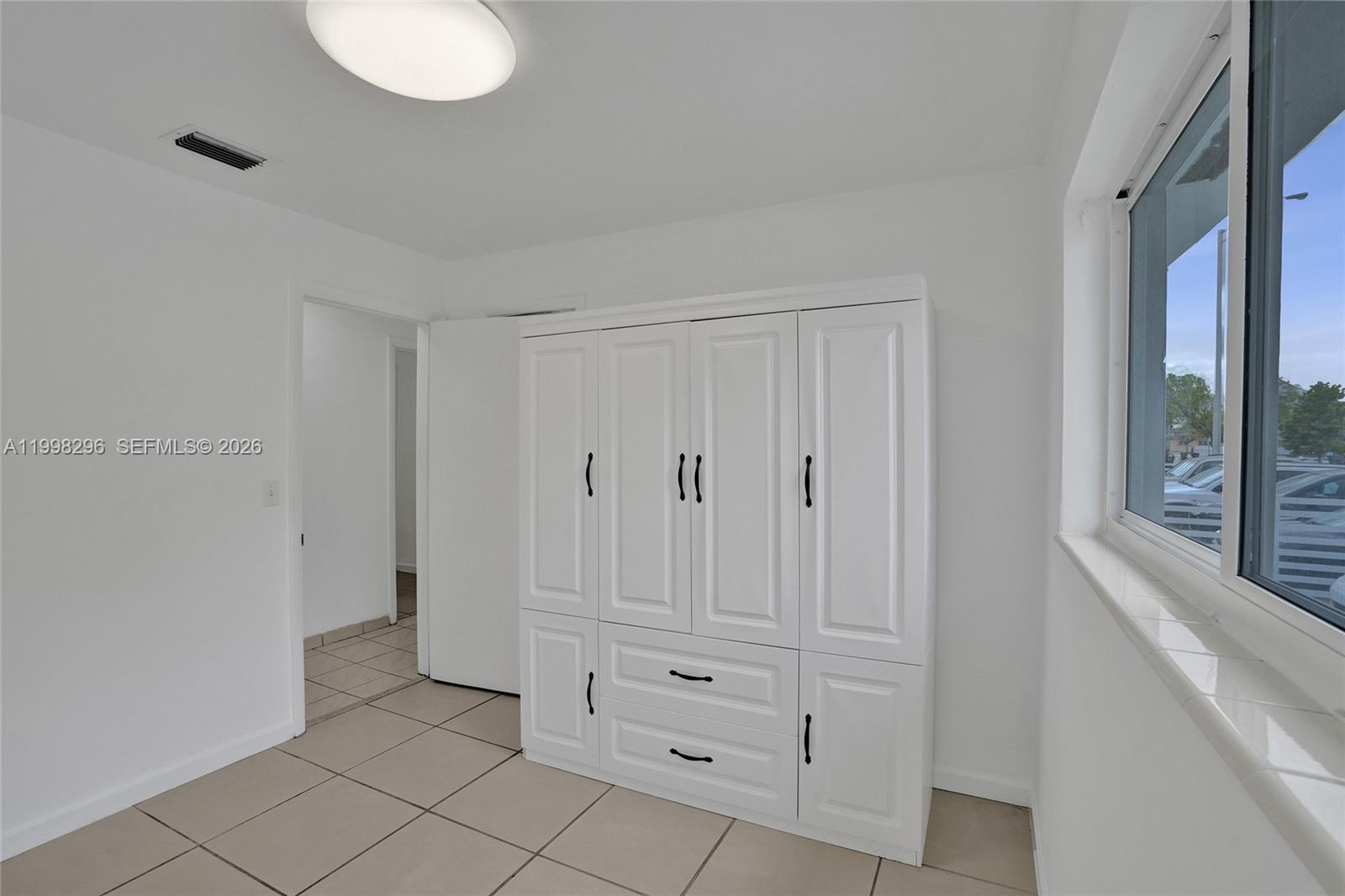877 West 33rd Street Hialeah, FL 33012 - Photo 48 of 59 a view of room with window