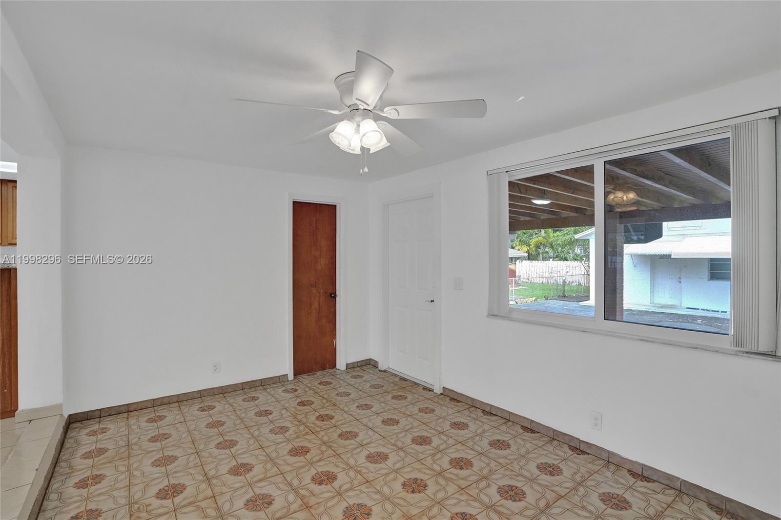 877 West 33rd Street Hialeah, FL 33012 - Photo 52 of 59 wooden floor in an empty room with a window