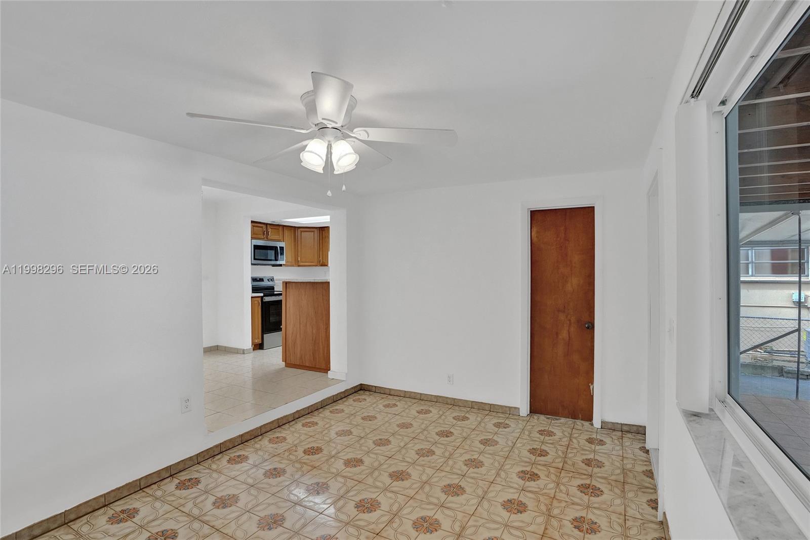 877 West 33rd Street Hialeah, FL 33012 - Photo 53 of 59 wooden floor in an empty room with a window