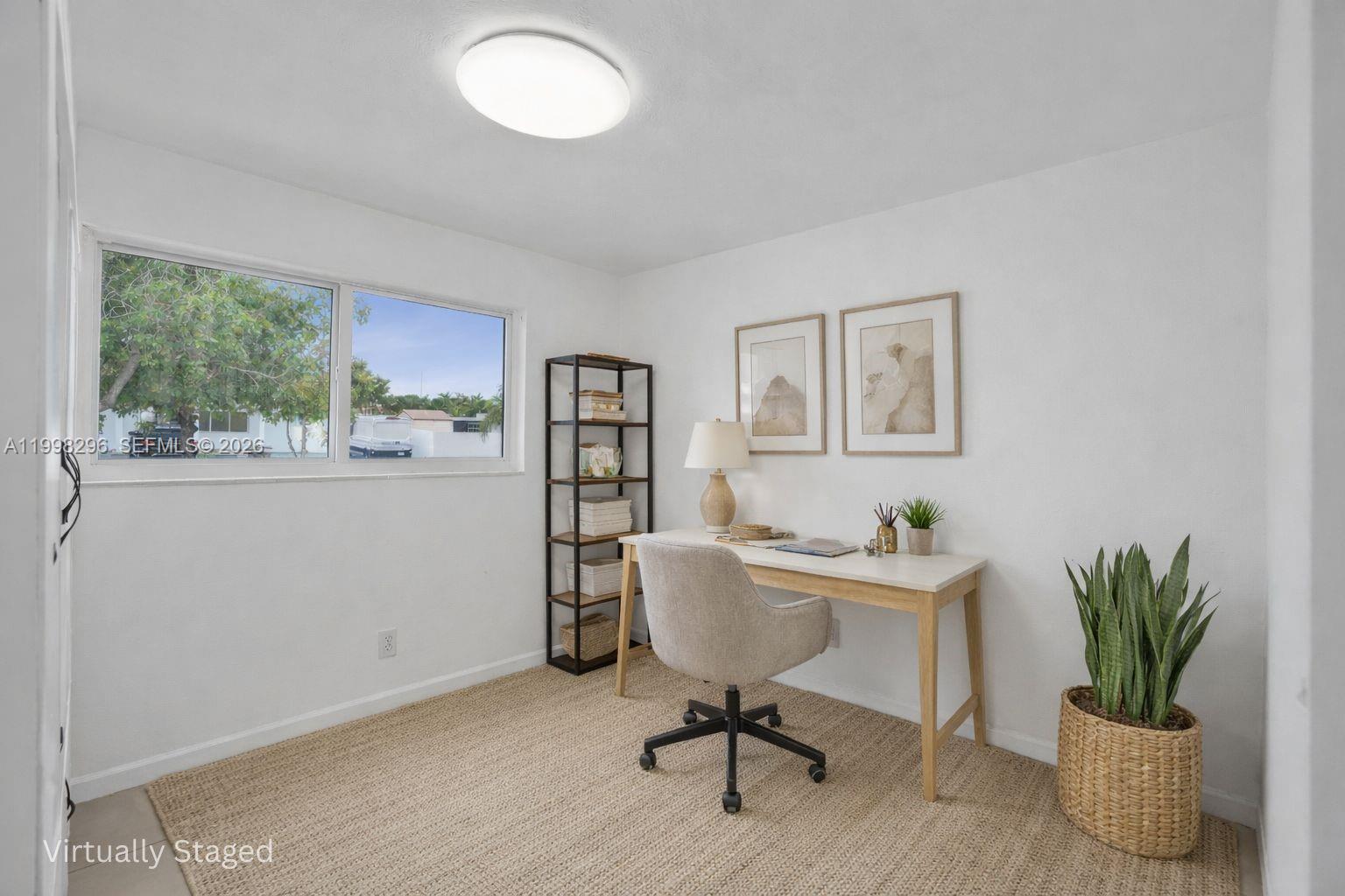 877 West 33rd Street Hialeah, FL 33012 - Photo 9 of 59 a workspace with furniture window and wooden floor