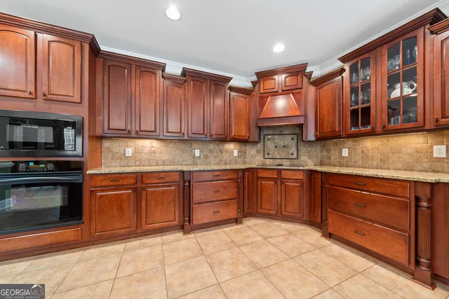 a dining room with furniture a chandelier and window