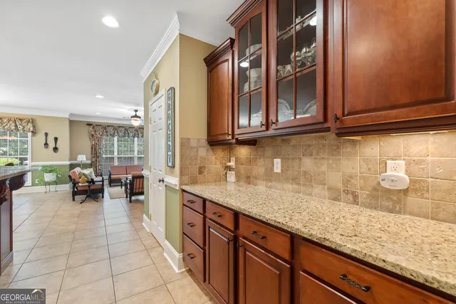 a spacious bathroom with a tub a sink and a large mirror