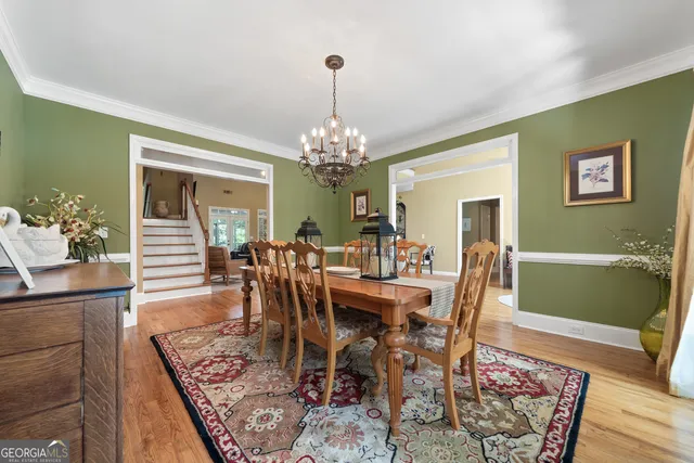 a view of a bedroom with furniture and window