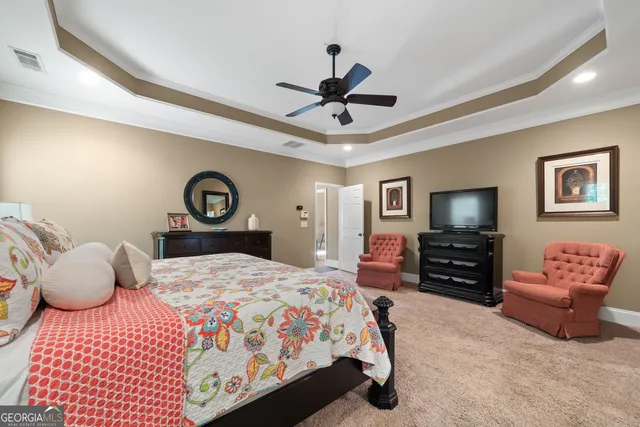 a bathroom with a granite countertop toilet sink and a mirror