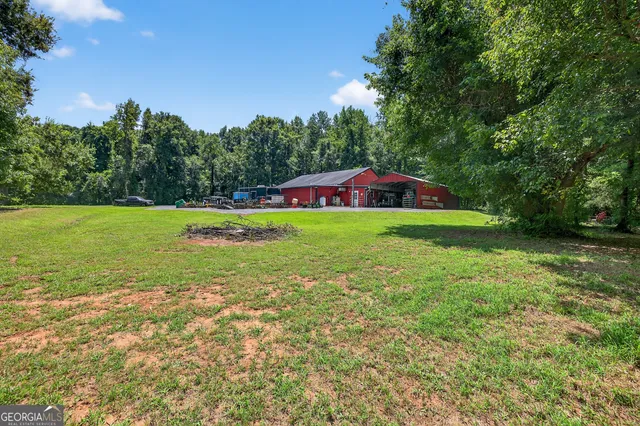 a view of a backyard with sitting area