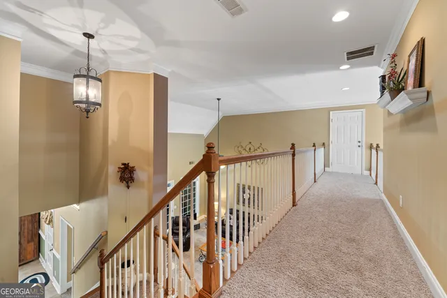 a kitchen with stainless steel appliances granite countertop a stove a sink dishwasher and cabinets with wooden floor