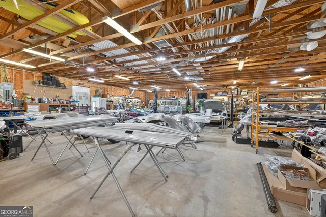 a kitchen with kitchen island granite countertop wooden cabinets and stainless steel appliances