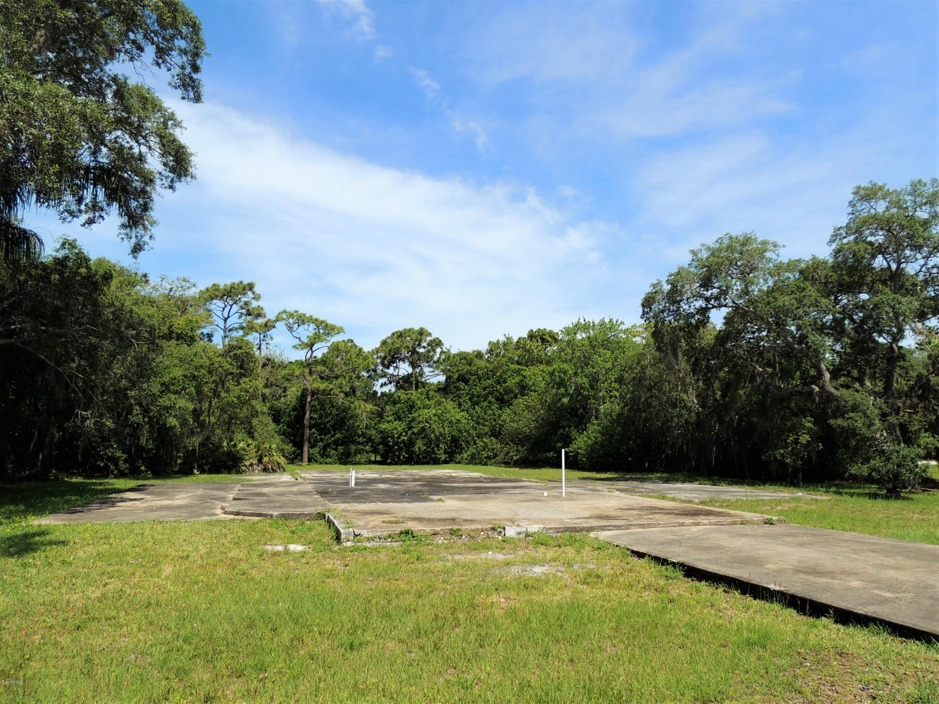 3570 Turtle Mound Road Melbourne, FL 32934 - Photo 16 of 19 a view of swimming pool with a yard