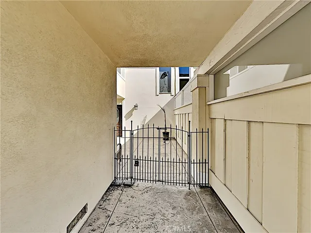 an empty room with closet and windows