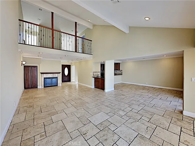 a big room with closet and fireplace