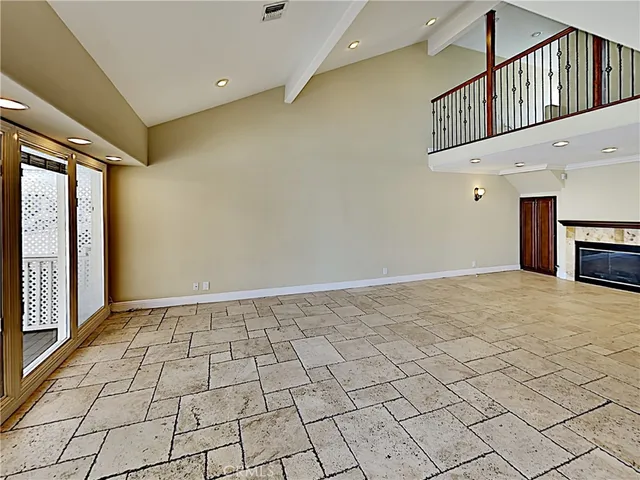 a kitchen with stainless steel appliances kitchen island granite countertop a refrigerator and a stove top oven