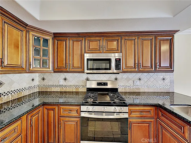a view of a kitchen that has a sink and a window