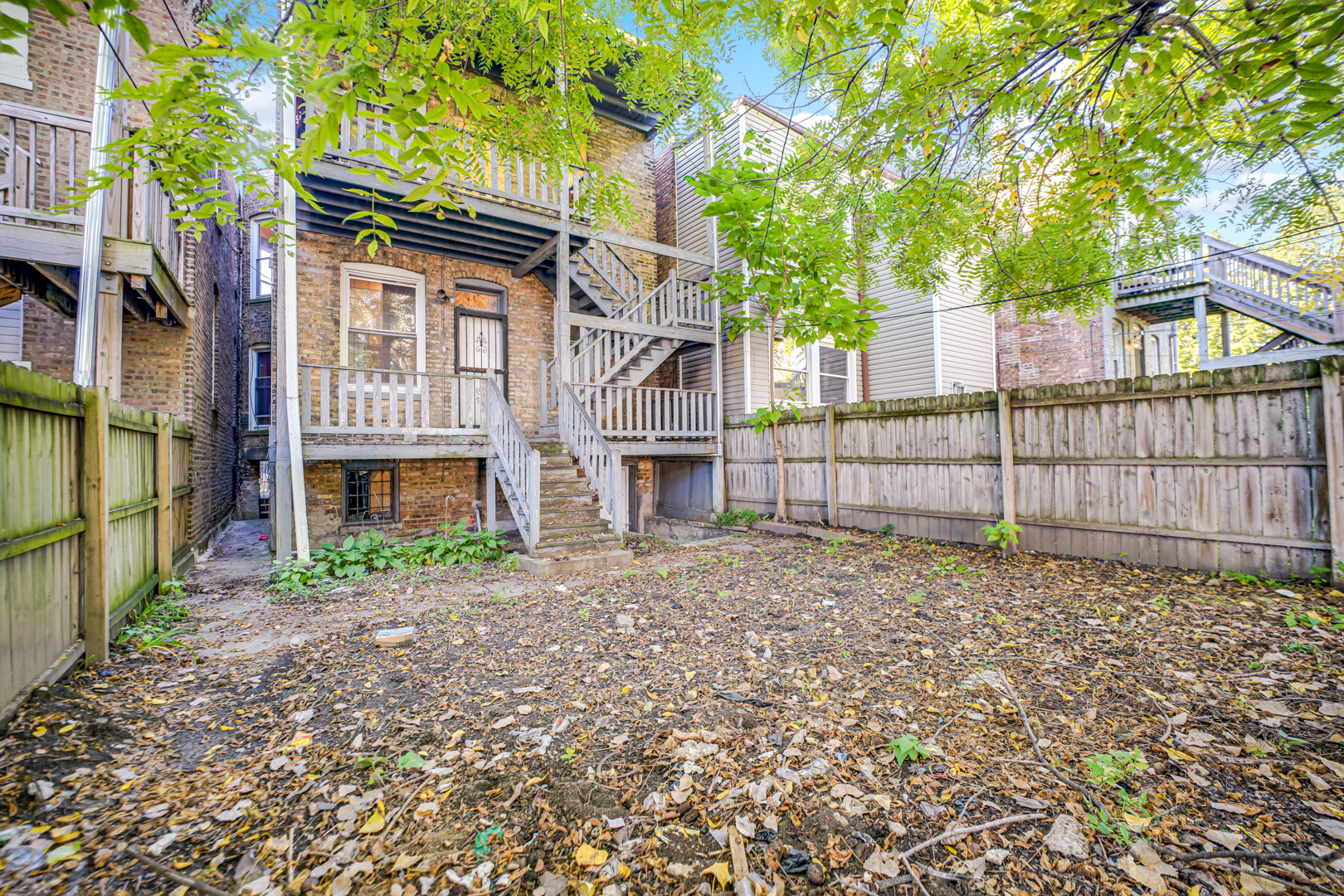 6045 South Peoria Street Chicago, IL 60621 - Photo 4 of 25 a view of a house with a yard