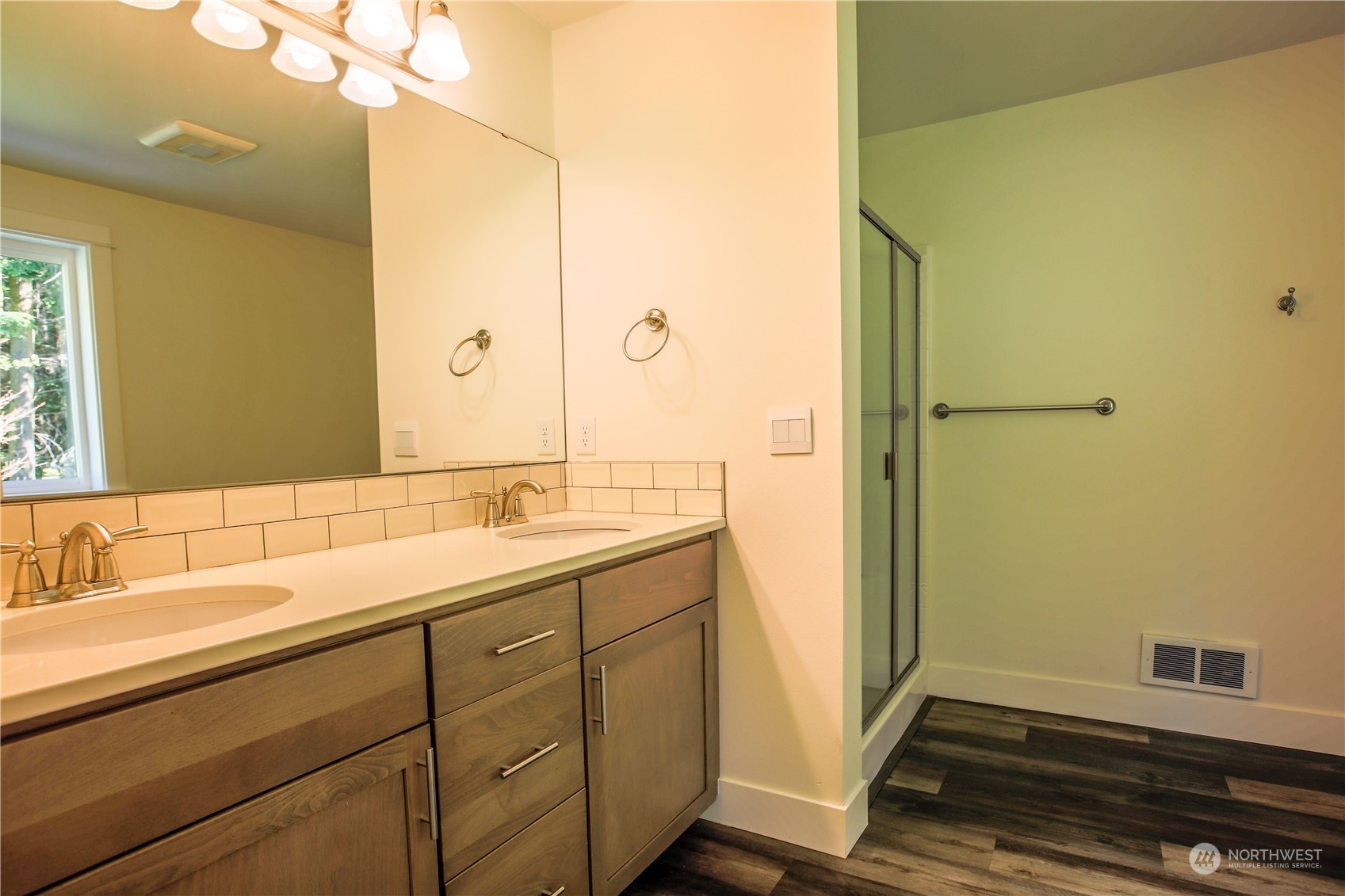 3867 East Harbor Road Langley, WA 98260 - Photo 14 of 39 a bathroom with a sink and a mirror