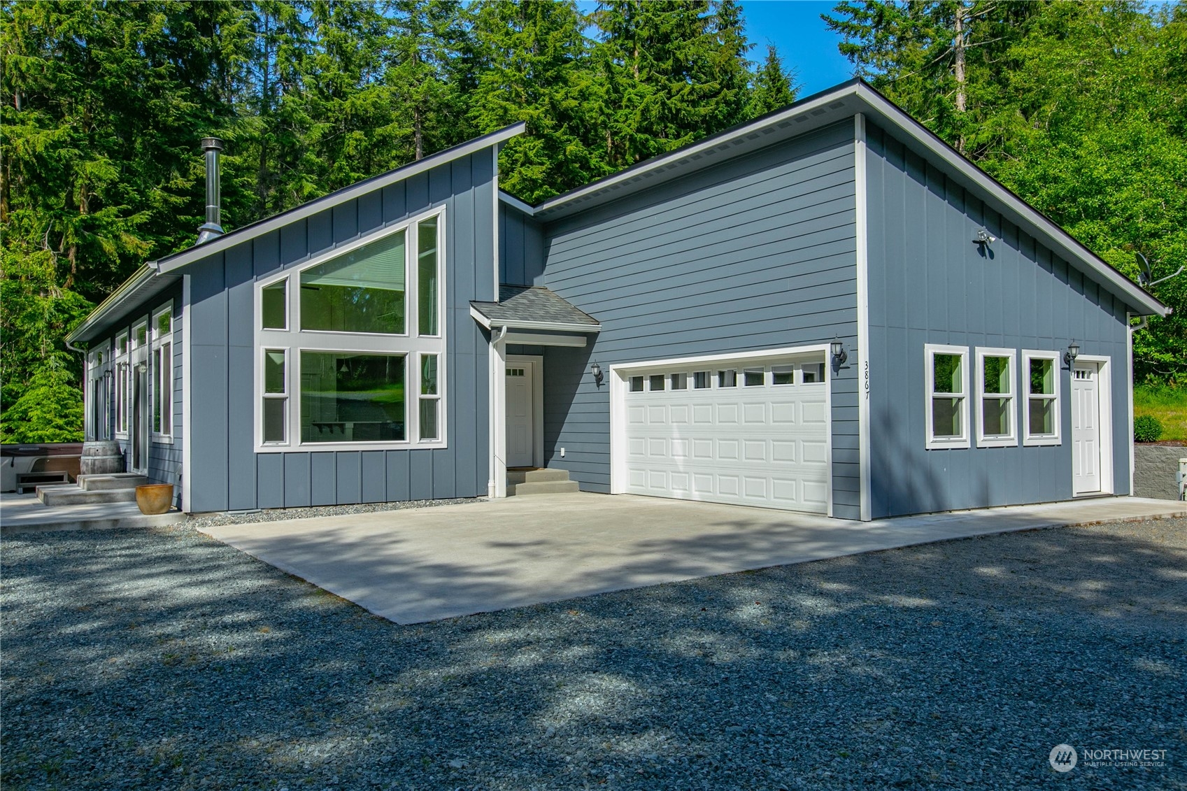 3867 East Harbor Road Langley, WA 98260 - Photo 2 of 39 a view of a house with porch and garden