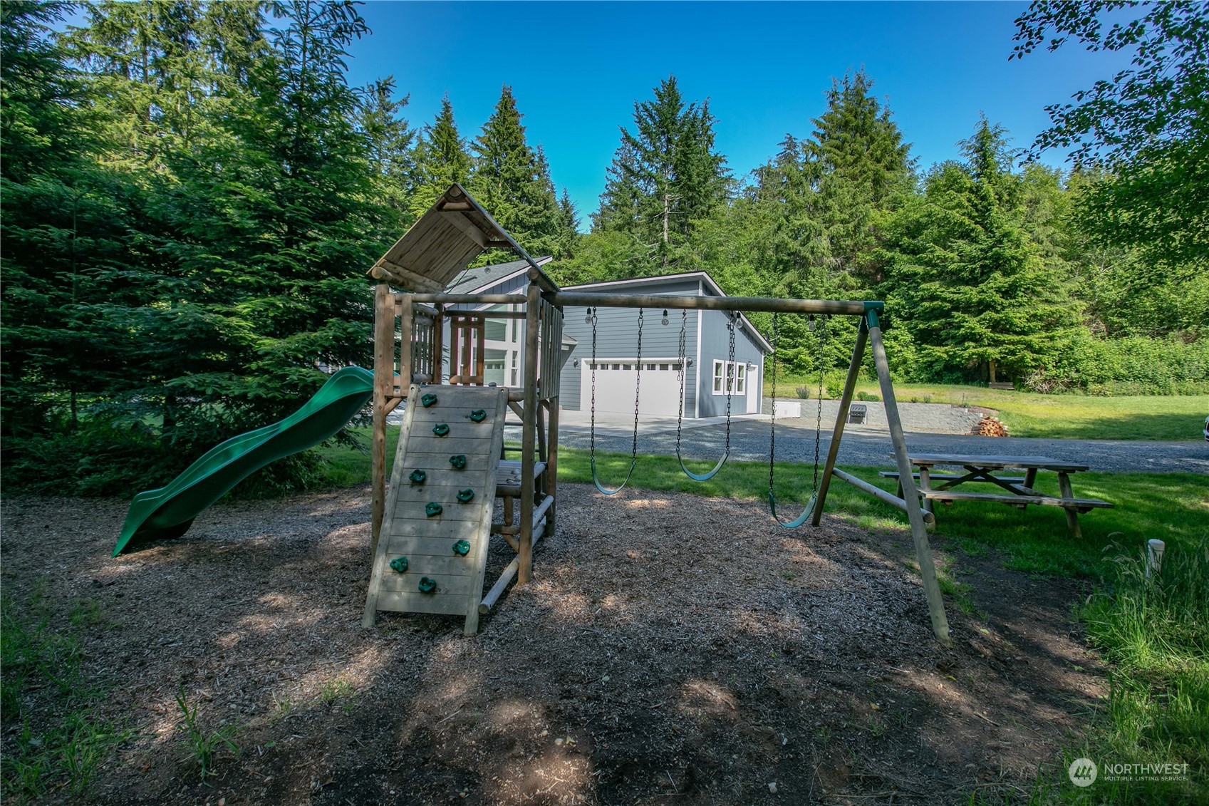 3867 East Harbor Road Langley, WA 98260 - Photo 24 of 39 a view of a house with a yard