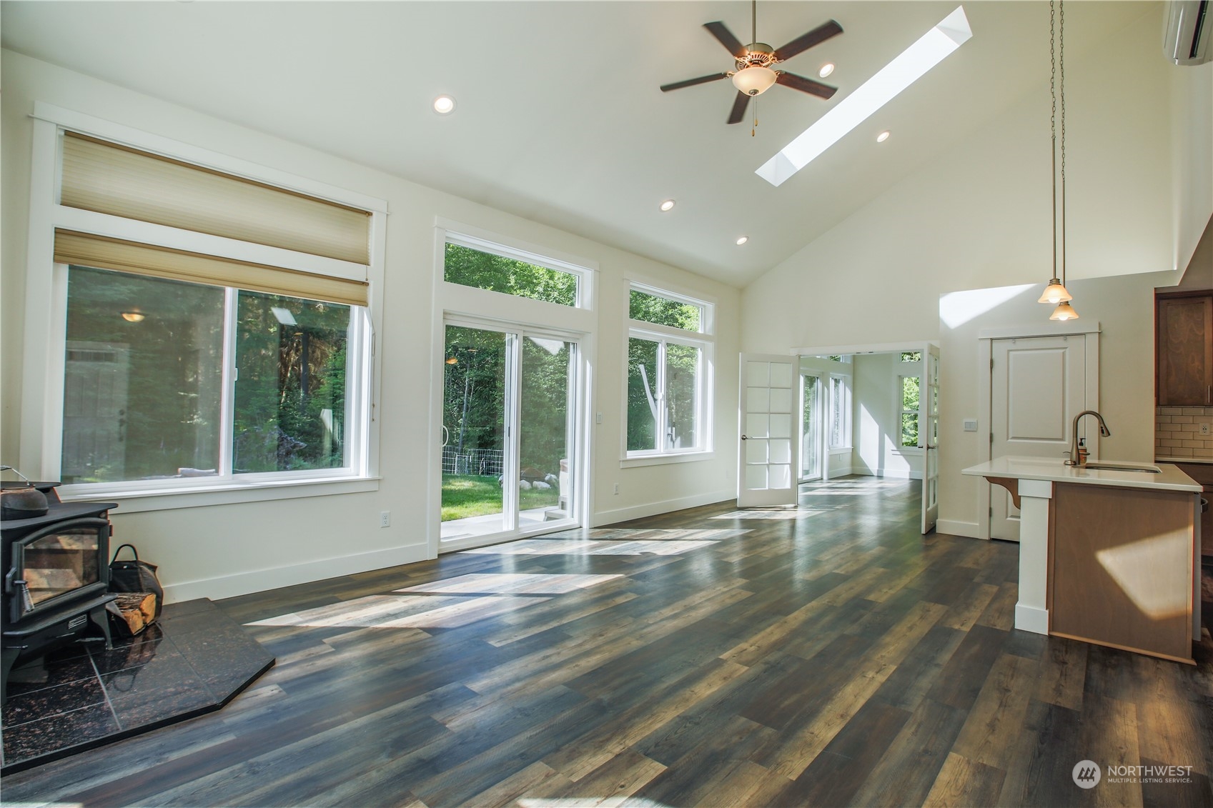 3867 East Harbor Road Langley, WA 98260 - Photo 3 of 39 a view of a livingroom with furniture hardwood floor ceiling fan and window
