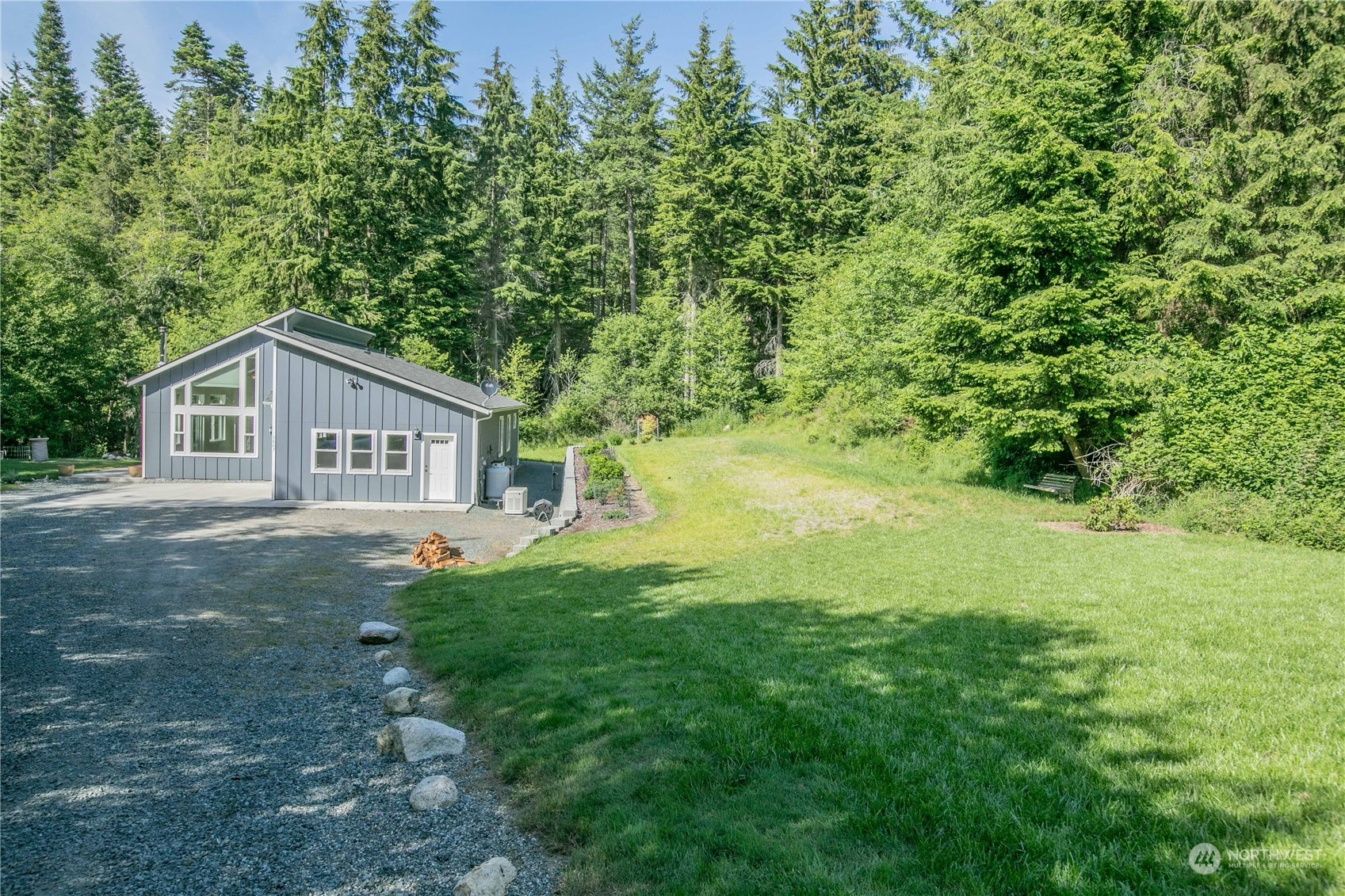 3867 East Harbor Road Langley, WA 98260 - Photo 38 of 39 a house with green field in front of it