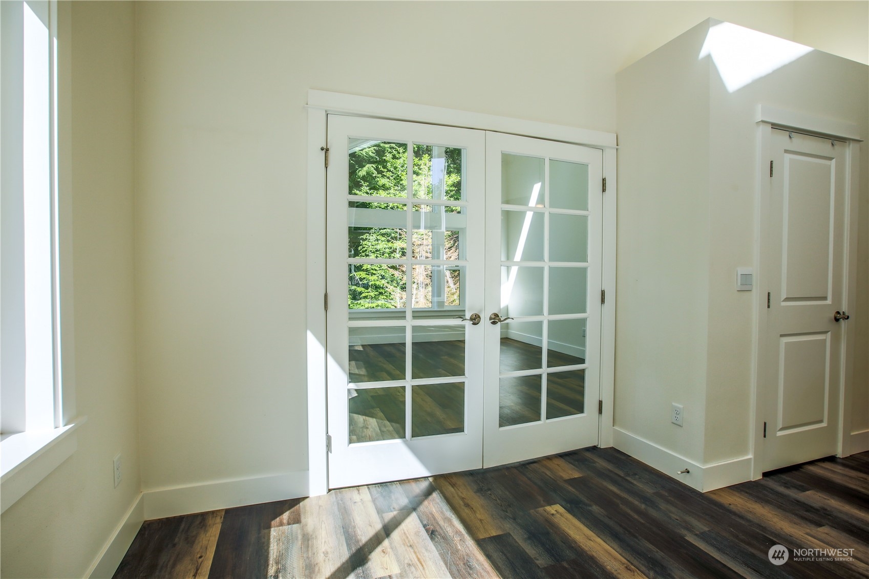 3867 East Harbor Road Langley, WA 98260 - Photo 8 of 39 a view of front door with wooden floor