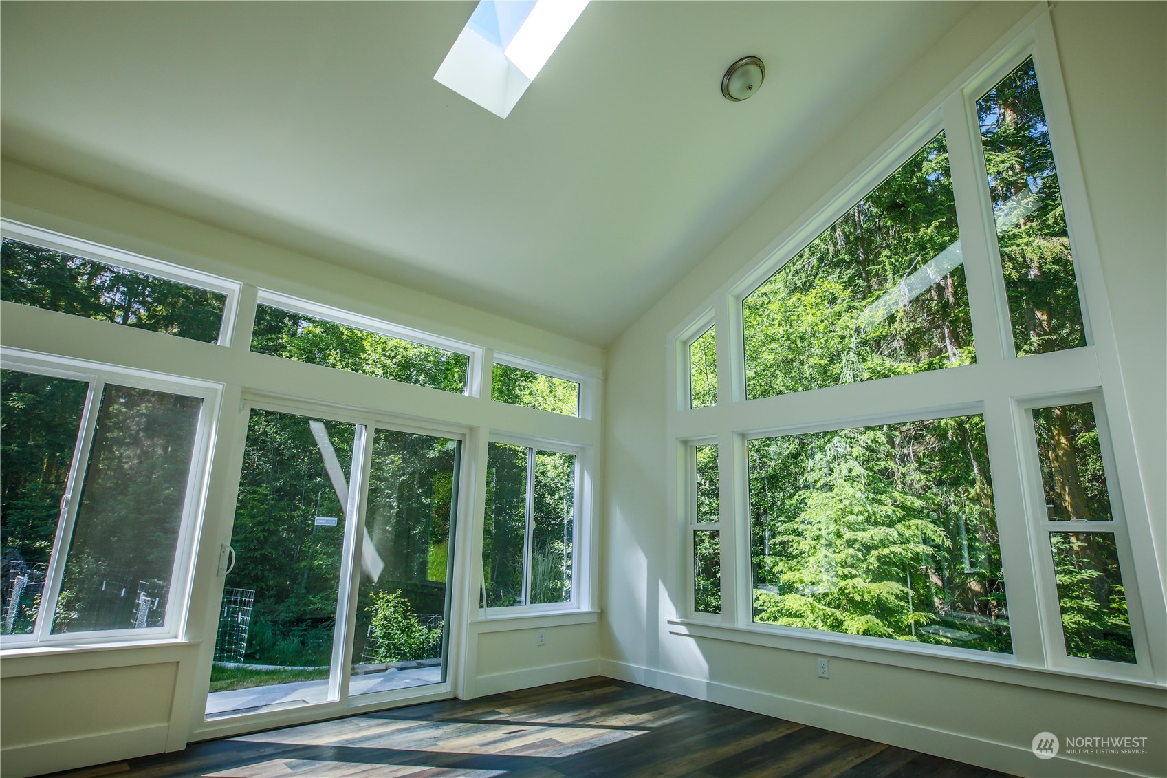 3867 East Harbor Road Langley, WA 98260 - Photo 10 of 39 a porch with a garden view