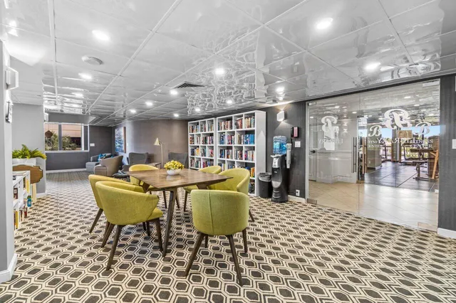 a living room with lots of furniture and a chandelier