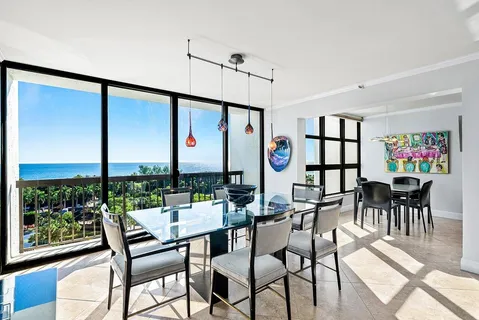 a view of a dining room with furniture window and outside view