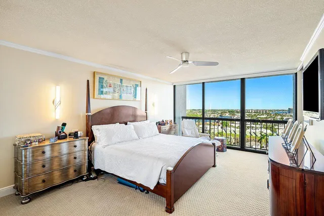 a bedroom with a bed and a night stand