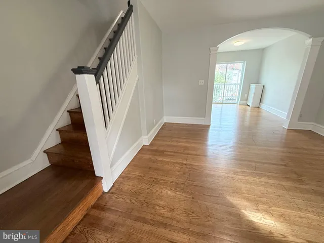 a view of an entryway with wooden floor