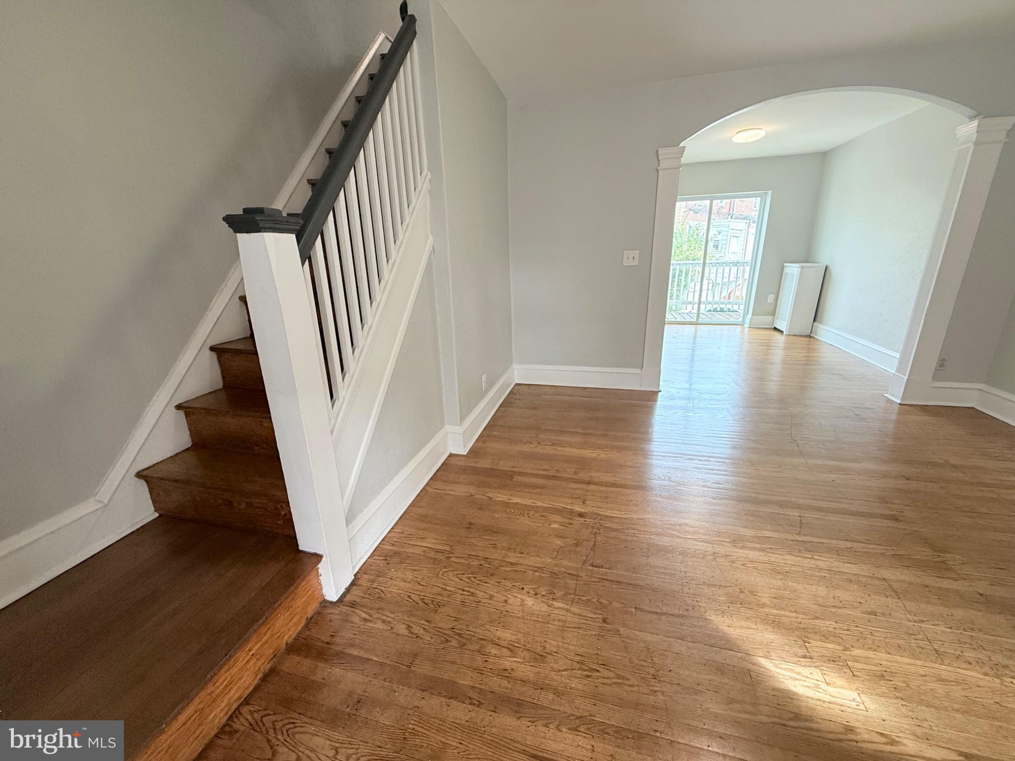 a view of an entryway with wooden floor