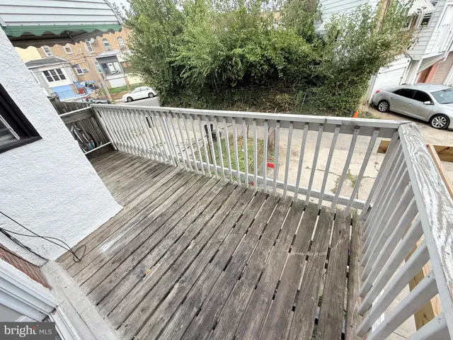 a balcony with wooden floor