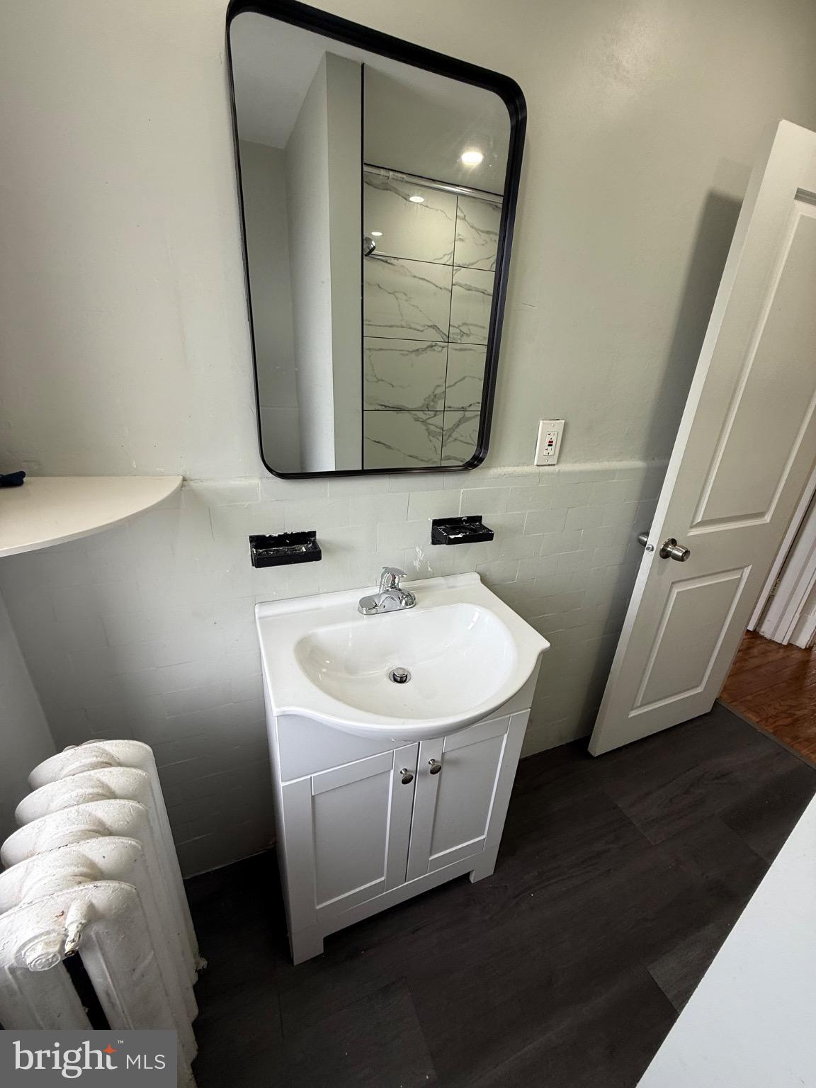 607 Littlecroft Road Upper Darby, PA 19082 - Photo 18 of 34 a bathroom with a sink toilet and a mirror