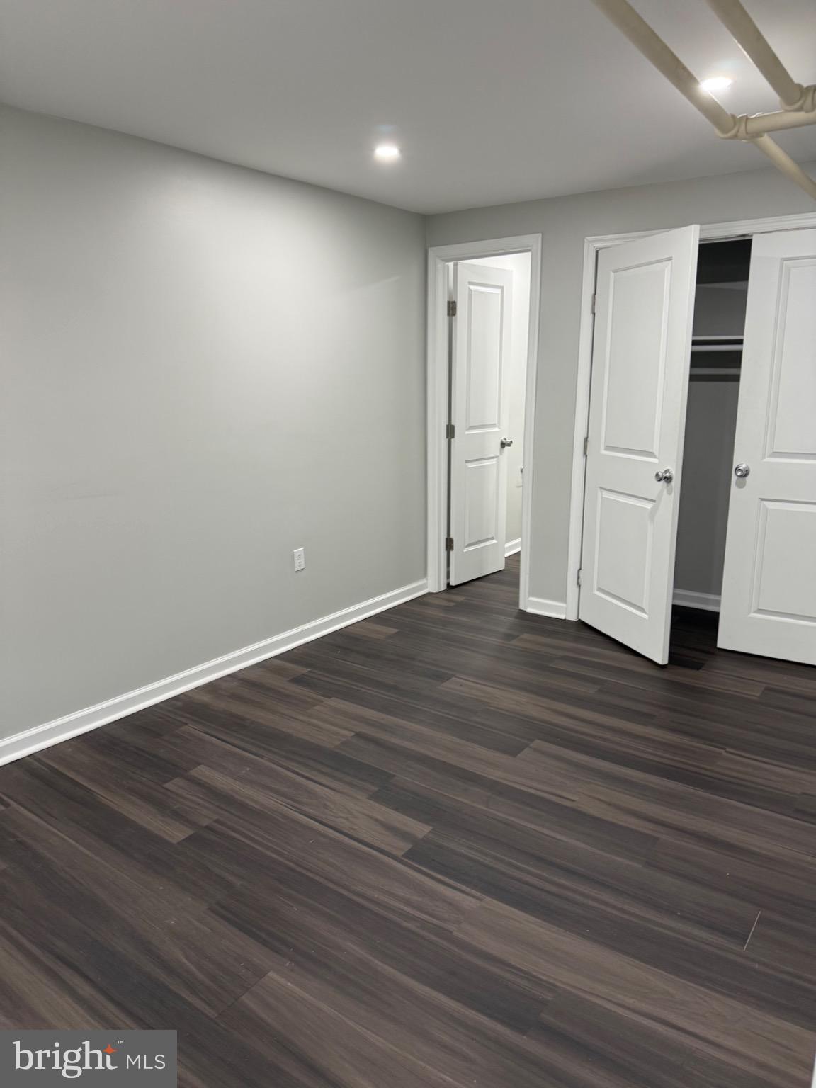 607 Littlecroft Road Upper Darby, PA 19082 - Photo 21 of 34 a view of an empty room with wooden floor and closet